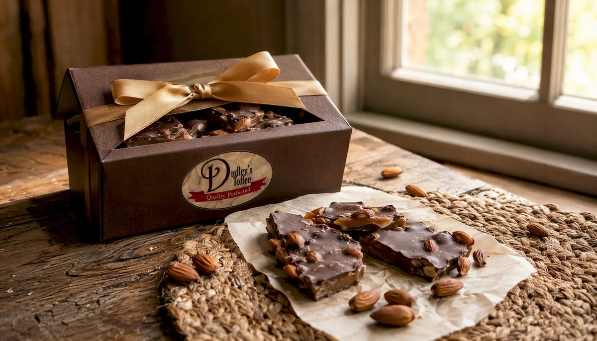 Box of handcrafted English almond toffee on rustic table