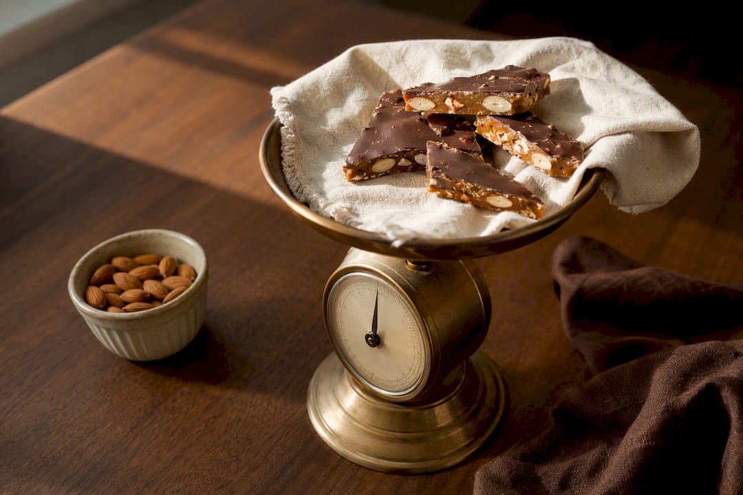Toffee pieces measured on a kitchen scale