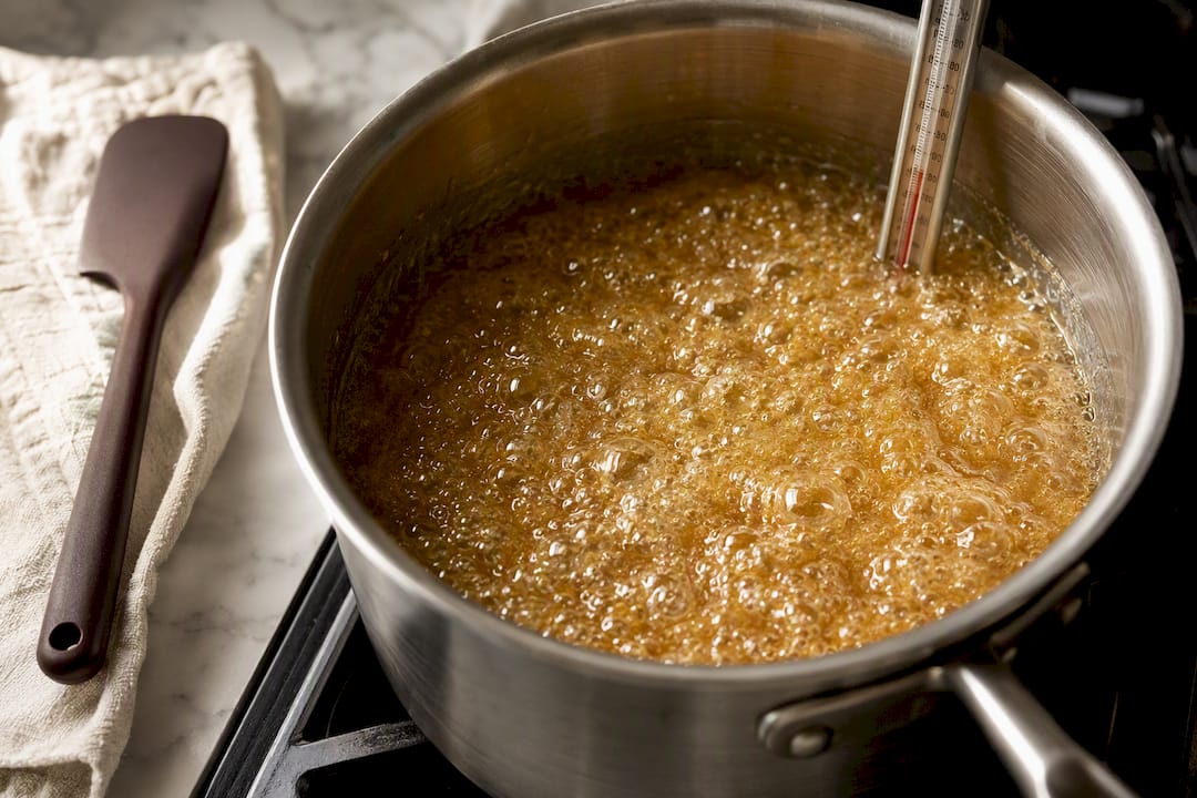 Butter sugar toffee cooking with thermometer