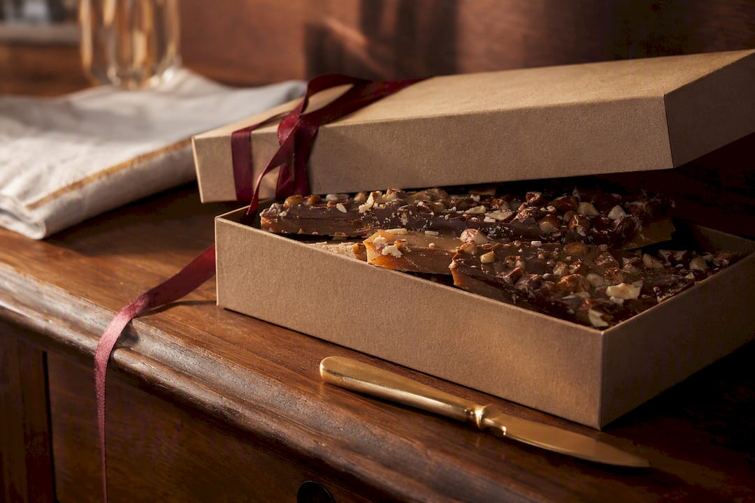 Anniversary toffee gift on walnut sideboard