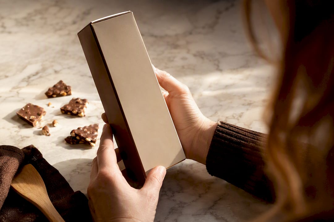 Shopper checking a toffee package for allergens