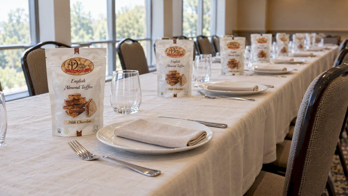 Toffee favor bags at corporate event place settings